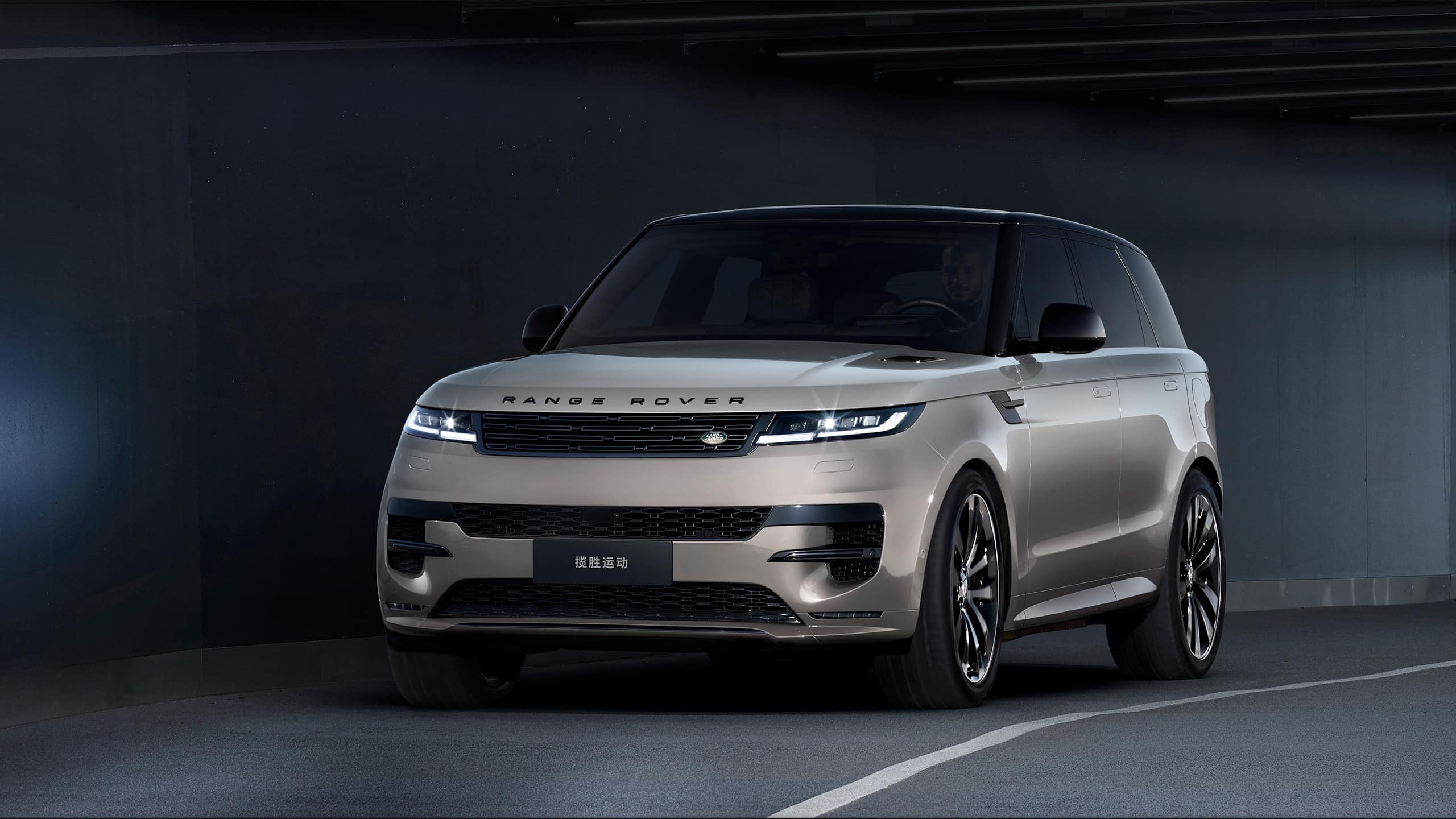 Front view of silver Range Rover in studio.